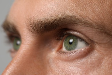 Image of Closeup view of man with green eyes