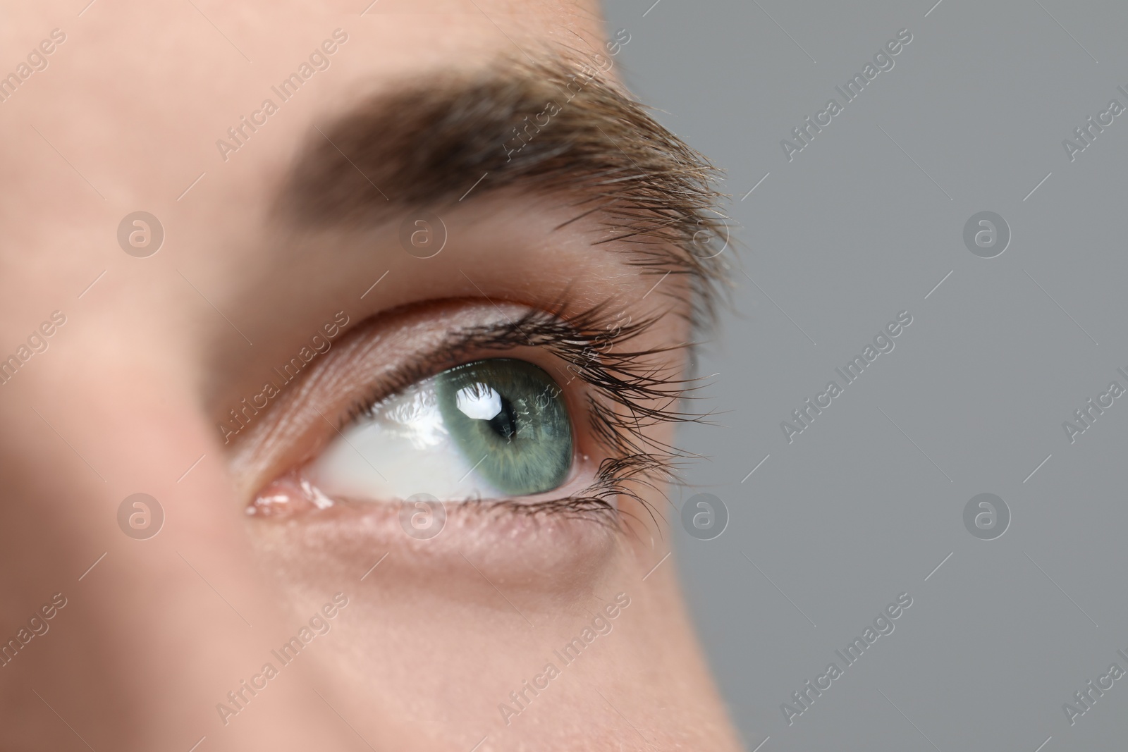 Image of Closeup view of man with green eyes