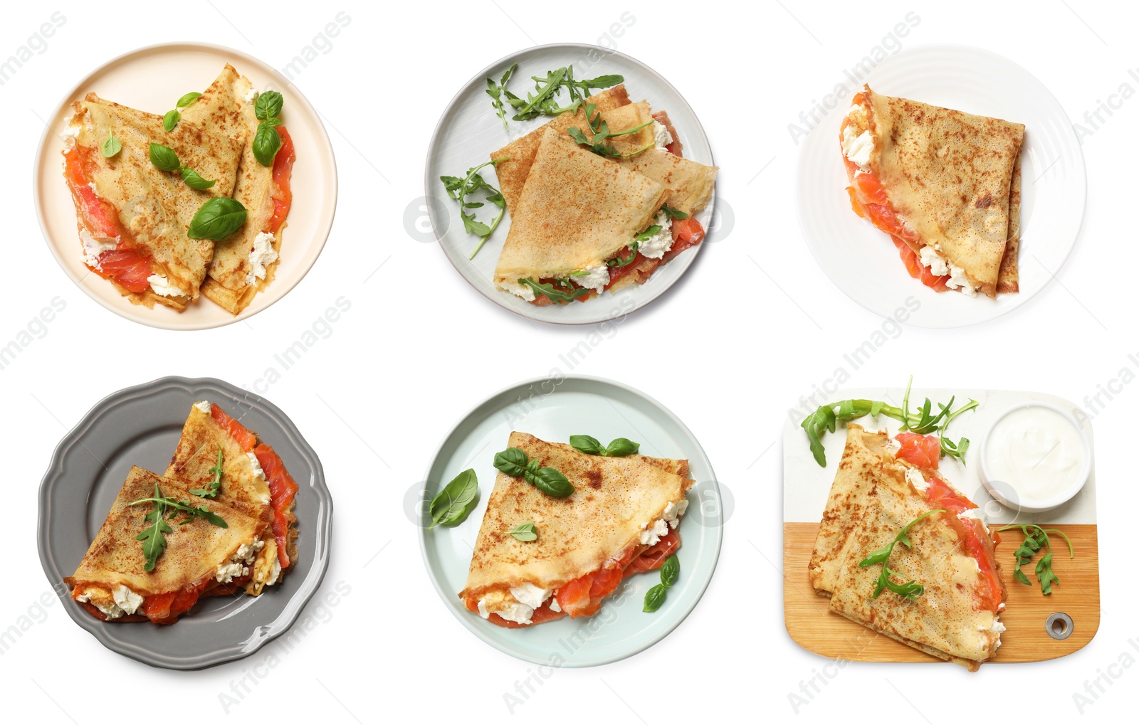 Image of Delicious crepes with salmon and cream cheese isolated on white, set. Top view