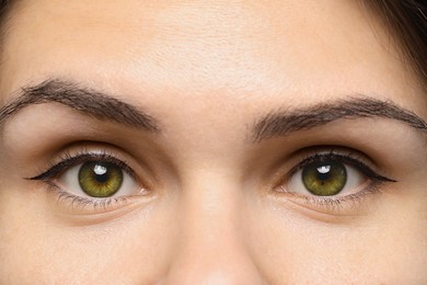 Image of Closeup view of woman with green eyes