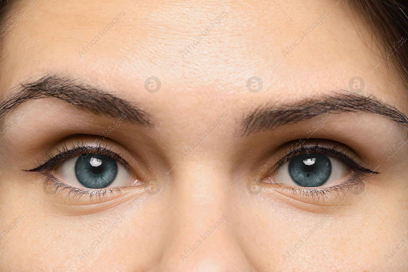 Image of Closeup view of woman with blue eyes