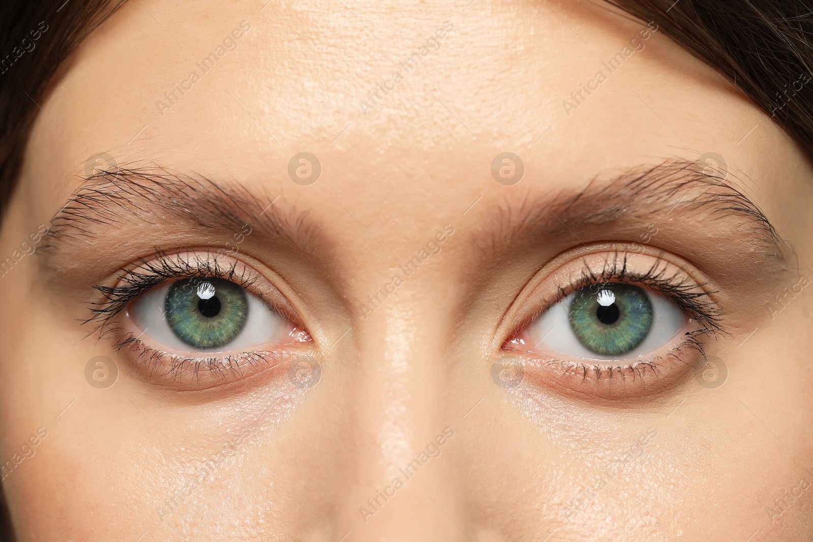 Image of Closeup view of woman with green eyes