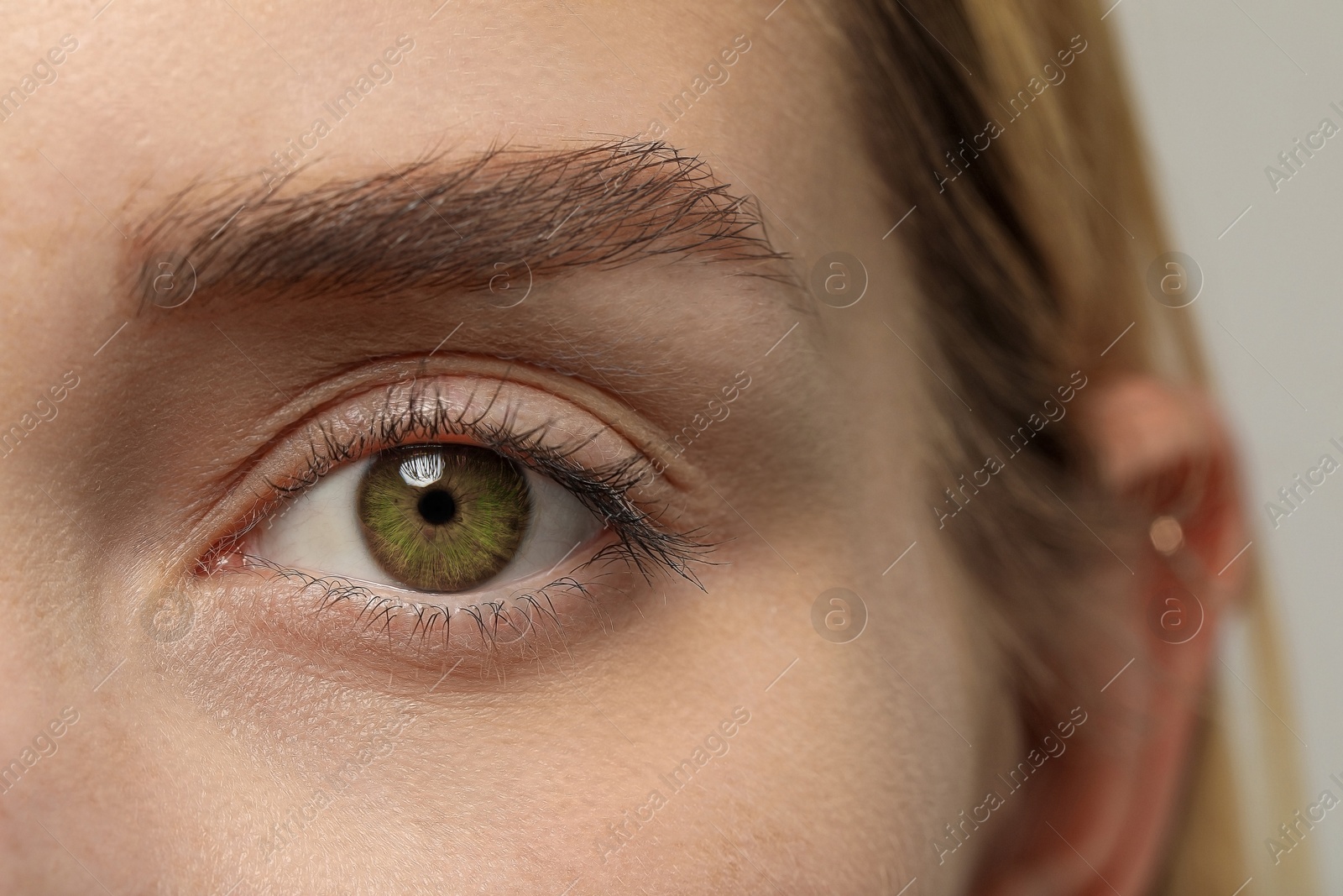 Image of Closeup view of woman with green eyes