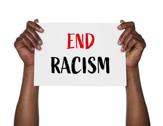 Image of Man holding paper with text End Racism on white background, closeup