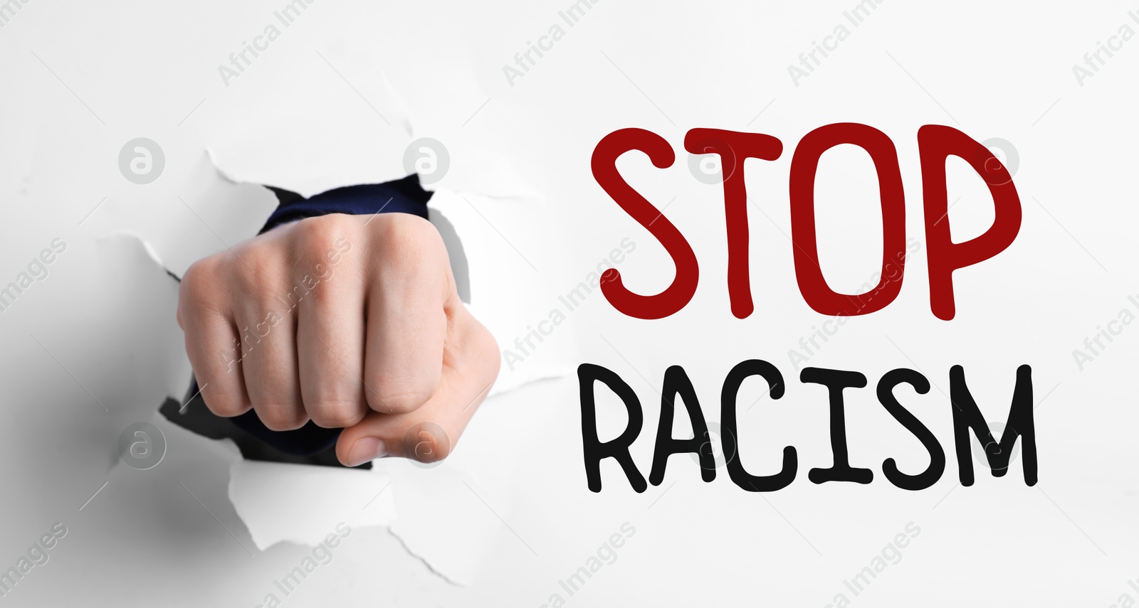 Image of Stop racism. Man breaking through white paper with fist, closeup. Banner design