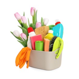 Image of Spring cleaning. Basket with detergents, supplies and tulips on white background