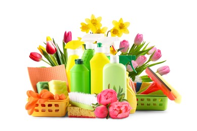 Image of Spring cleaning. Detergents, supplies and flowers on white background