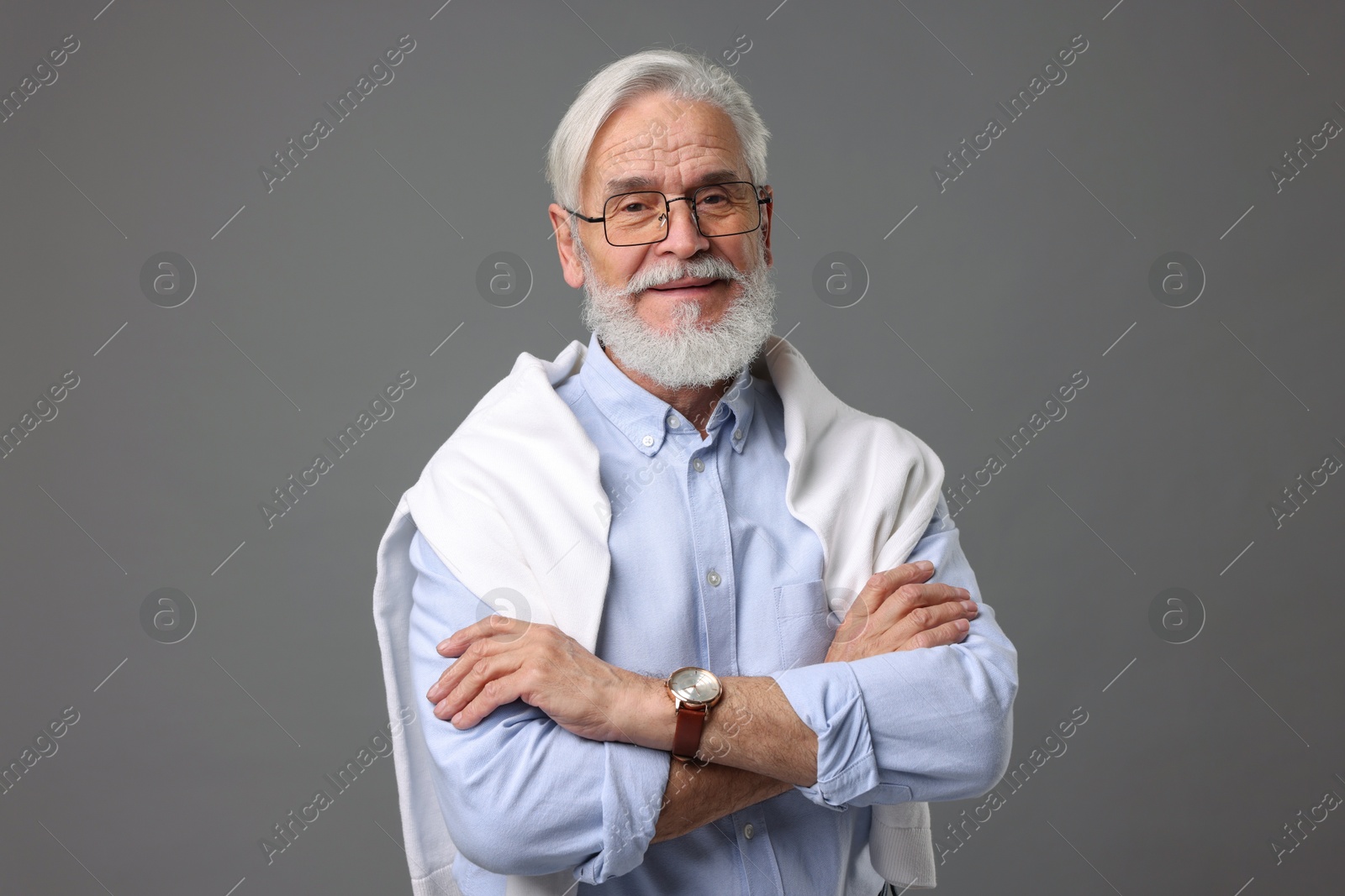 Photo of Portrait of stylish bearded man on grey background