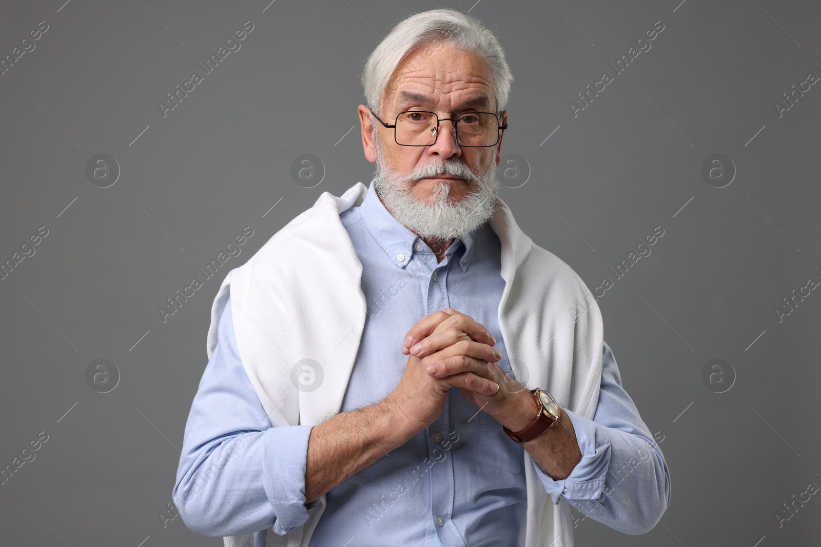 Photo of Portrait of stylish bearded man on grey background