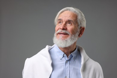 Photo of Portrait of stylish bearded man on grey background