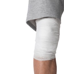 Photo of Man with medical bandage on his knee against white background, closeup