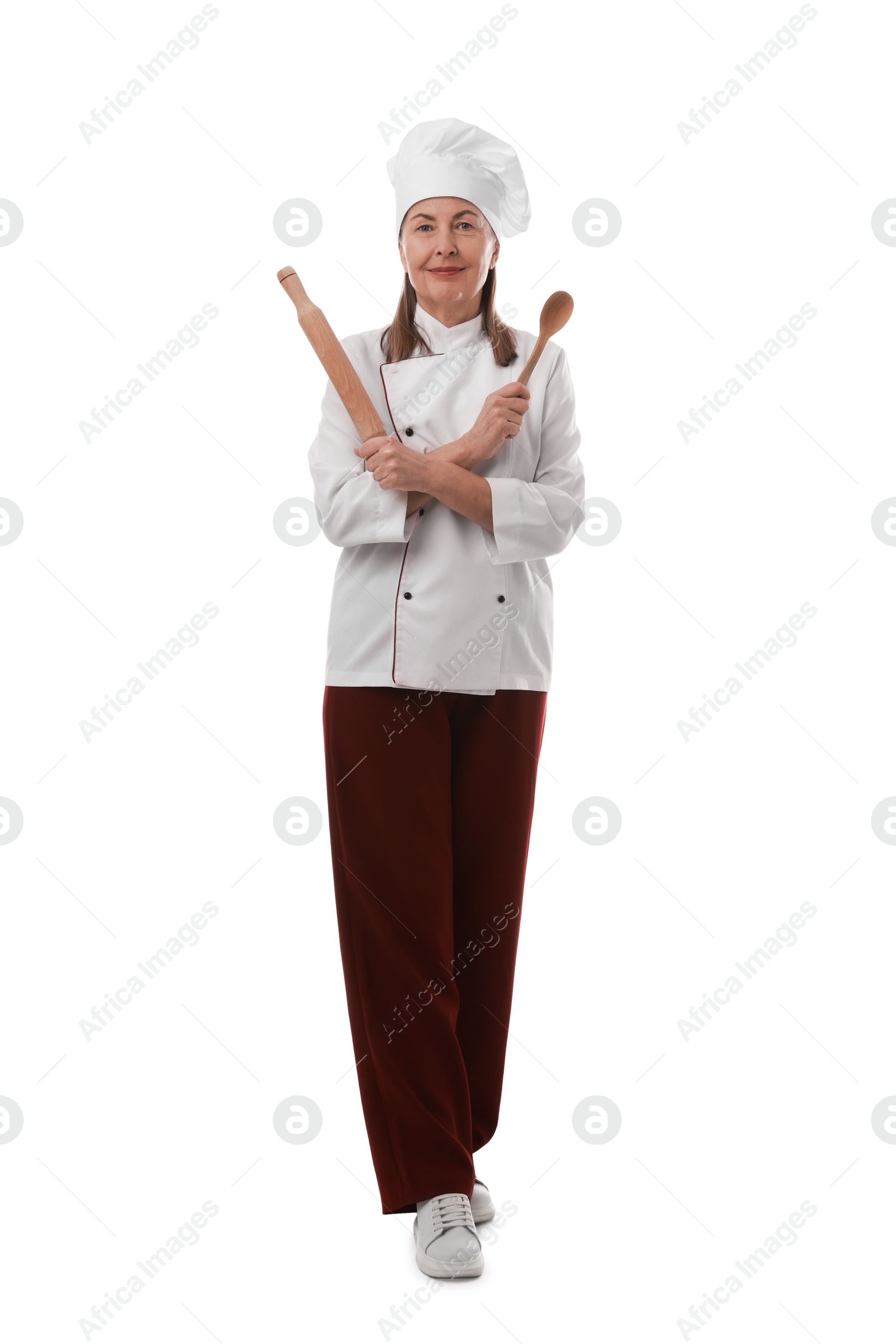 Photo of Chef with rolling pin and spoon on white background