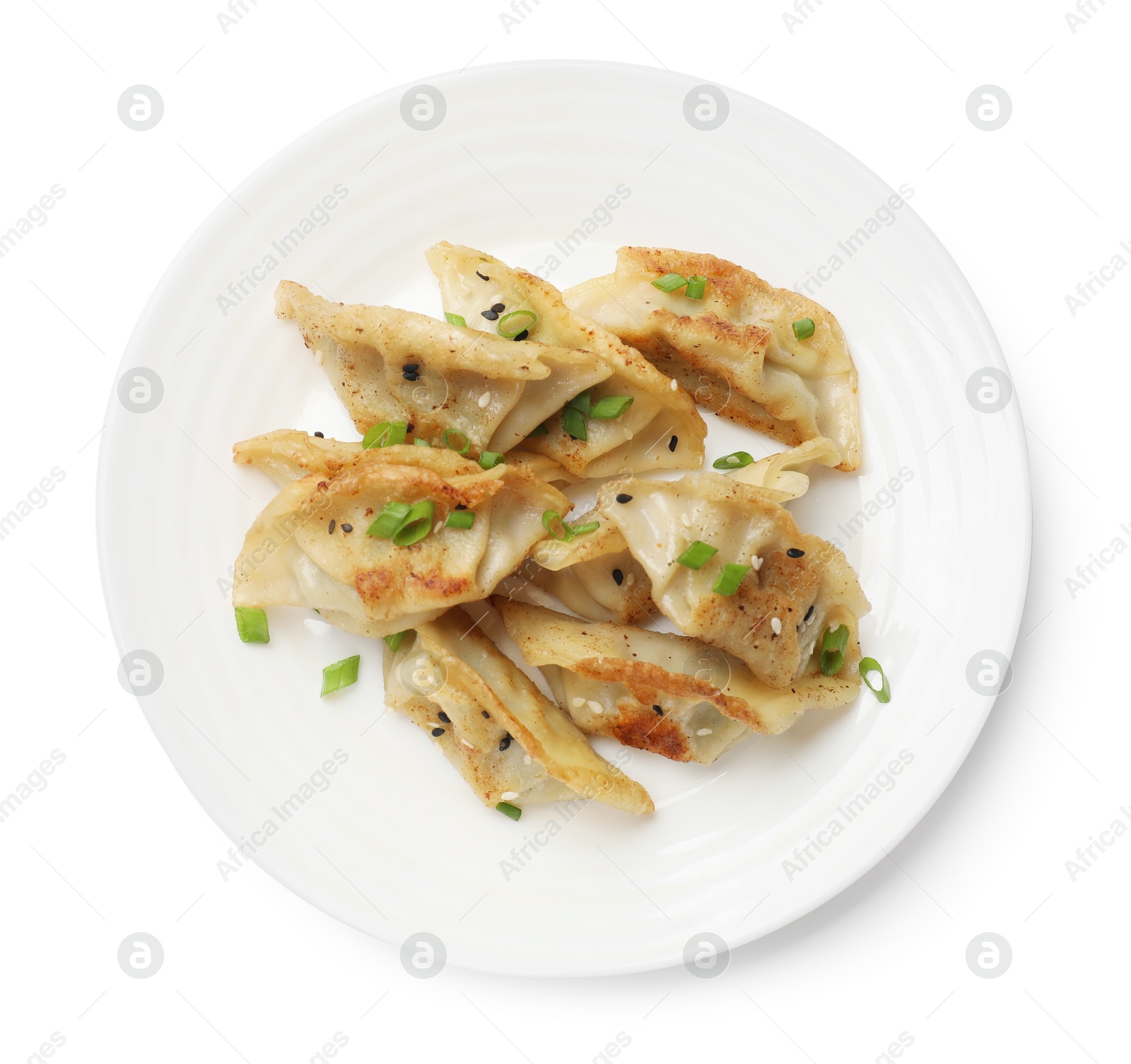 Photo of Tasty fried gyoza dumplings with green onion isolated on white, top view