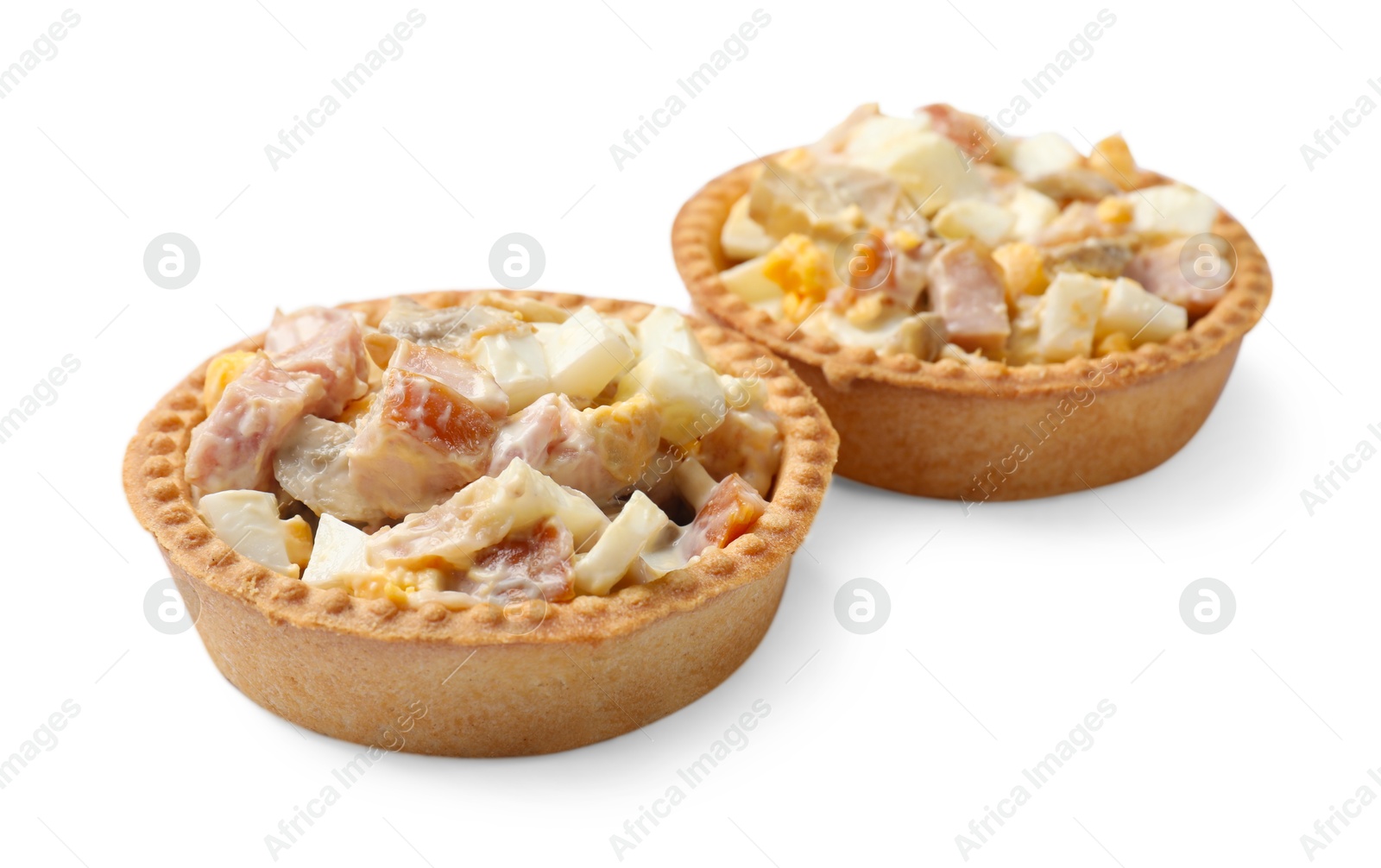 Photo of Tartlets with delicious filling isolated on white