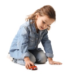 Photo of Little girl playing with toy car on white background