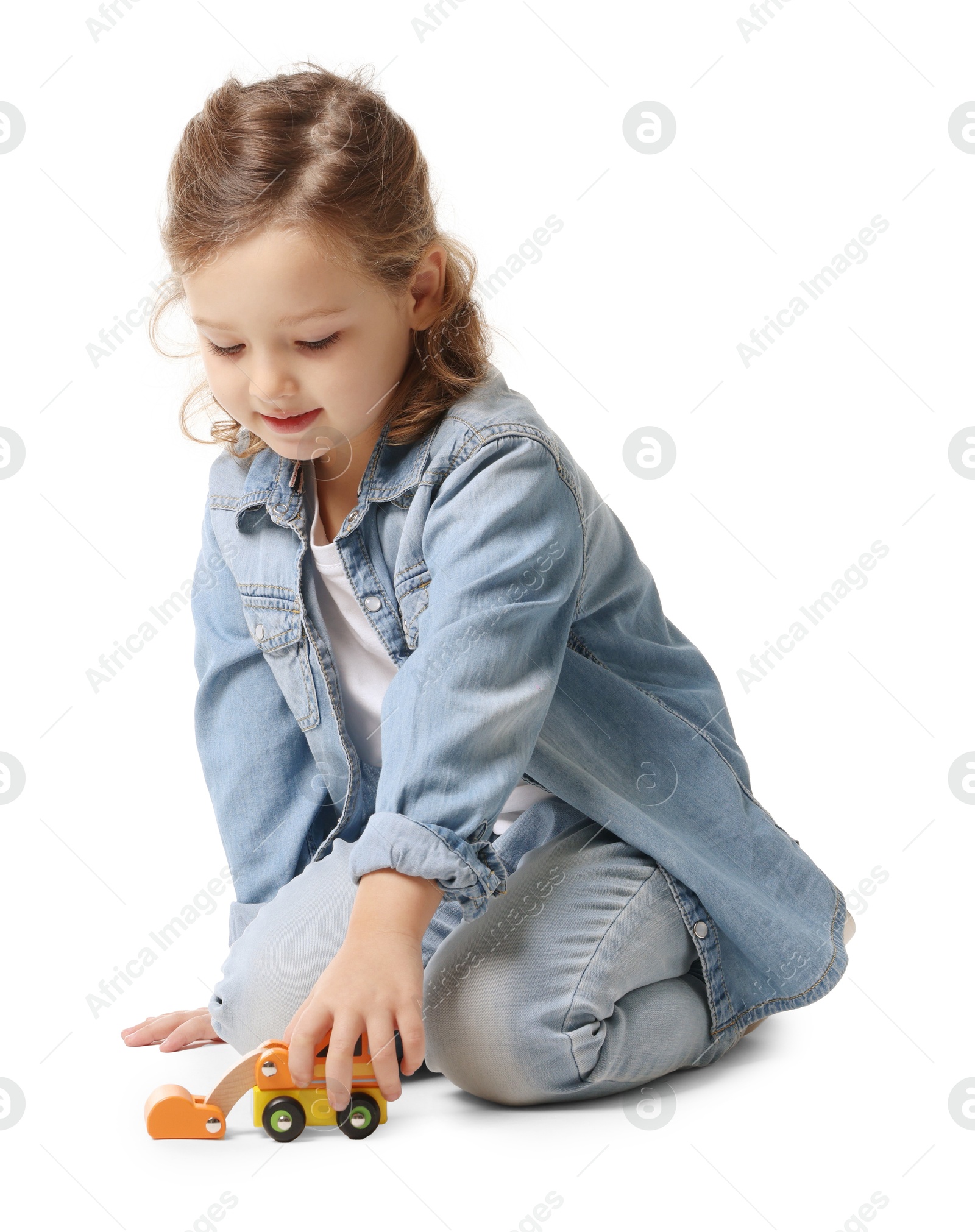 Photo of Little girl playing with toy car on white background