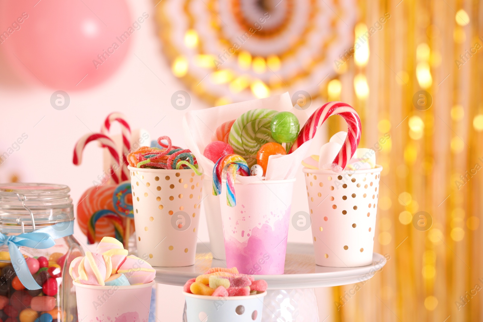 Photo of Candy bar. Many different sweets in festive decorated room, closeup