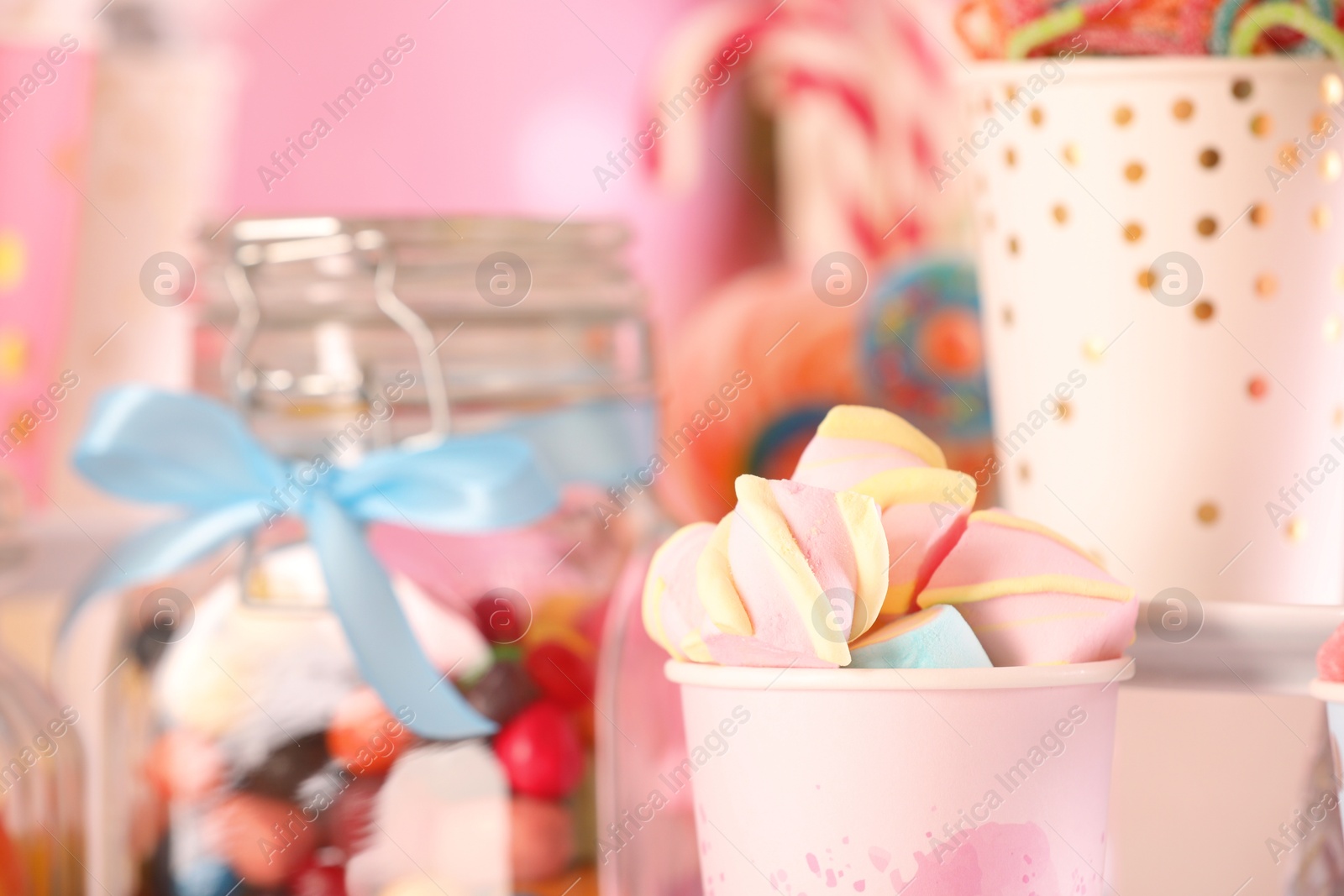 Photo of Candy bar. Many different sweets on blurred background, closeup. Space for text