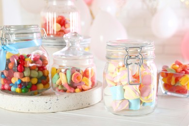 Photo of Candy bar. Many different sweets on white wooden table indoors