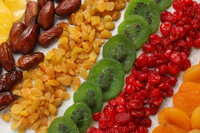 Photo of Different dried fruits on light table, flat lay