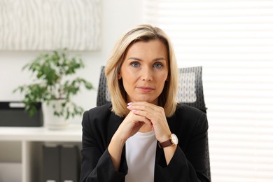 Photo of Portrait of beautiful businesswoman in jacket indoors