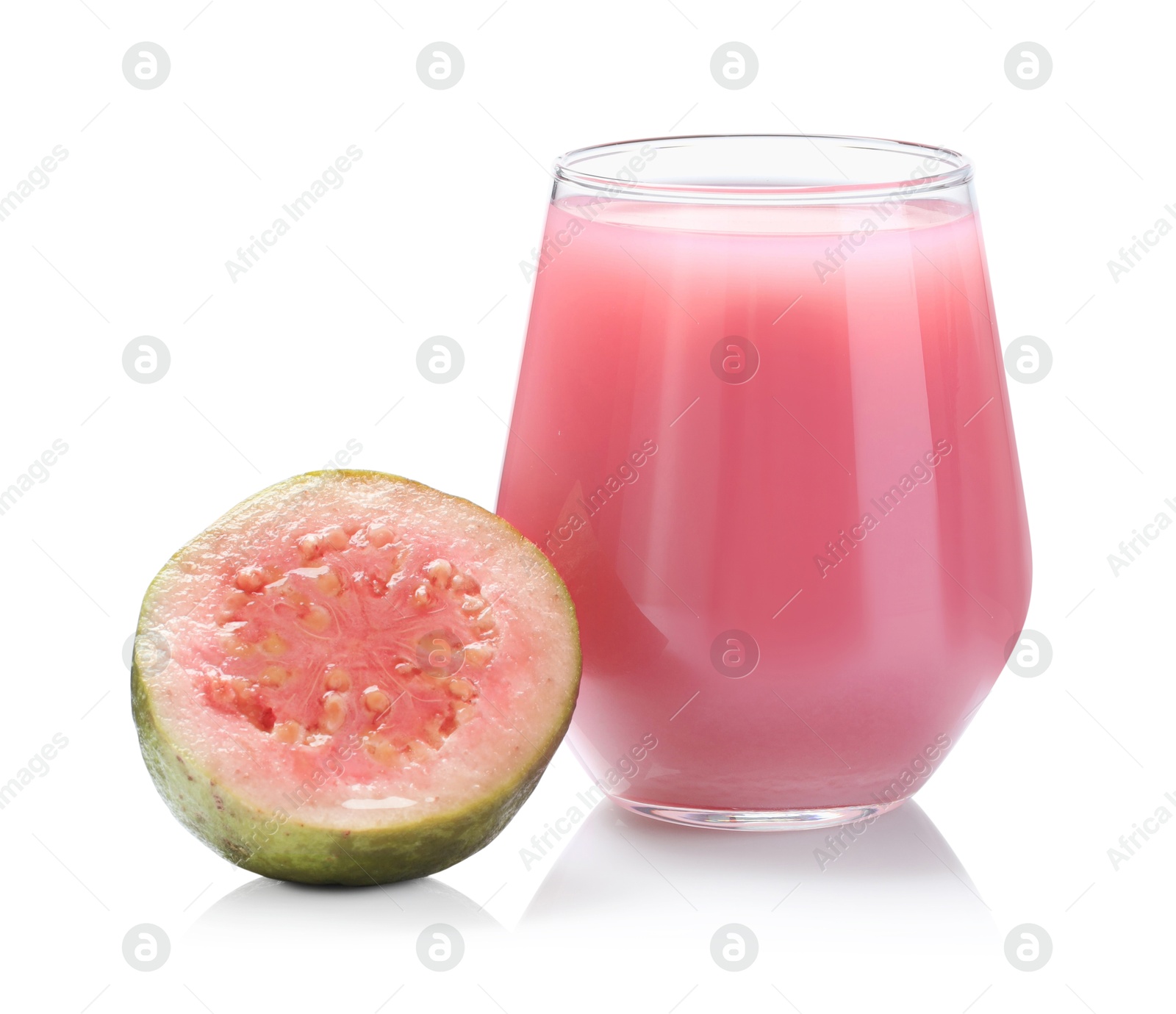 Photo of Tasty guava juice in glass and fresh fruit isolated on white