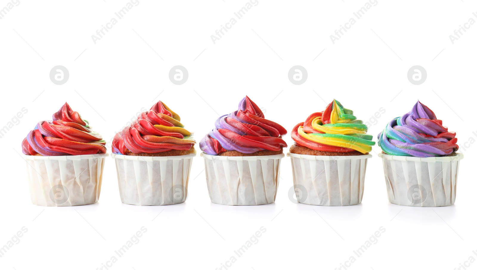 Photo of Delicious cupcakes with colorful cream isolated on white