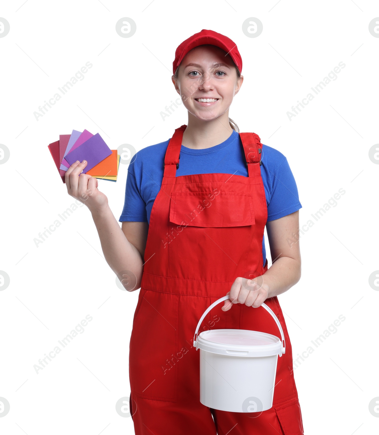 Photo of Professional painter with color samples and bucket of paint on white background