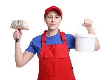 Photo of Professional painter with brush and bucket of paint on white background