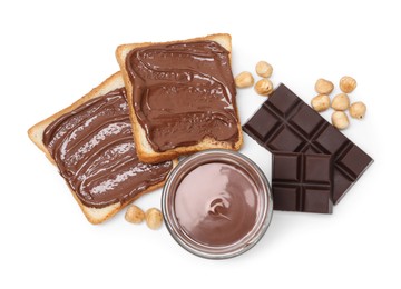 Photo of Tasty sandwiches with chocolate butter, pieces of chocolate and hazelnuts isolated on white, top view