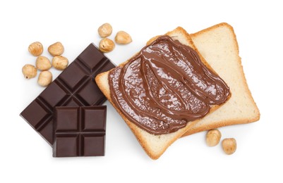 Photo of Tasty sandwiches with chocolate butter, pieces of chocolate and hazelnuts isolated on white, top view