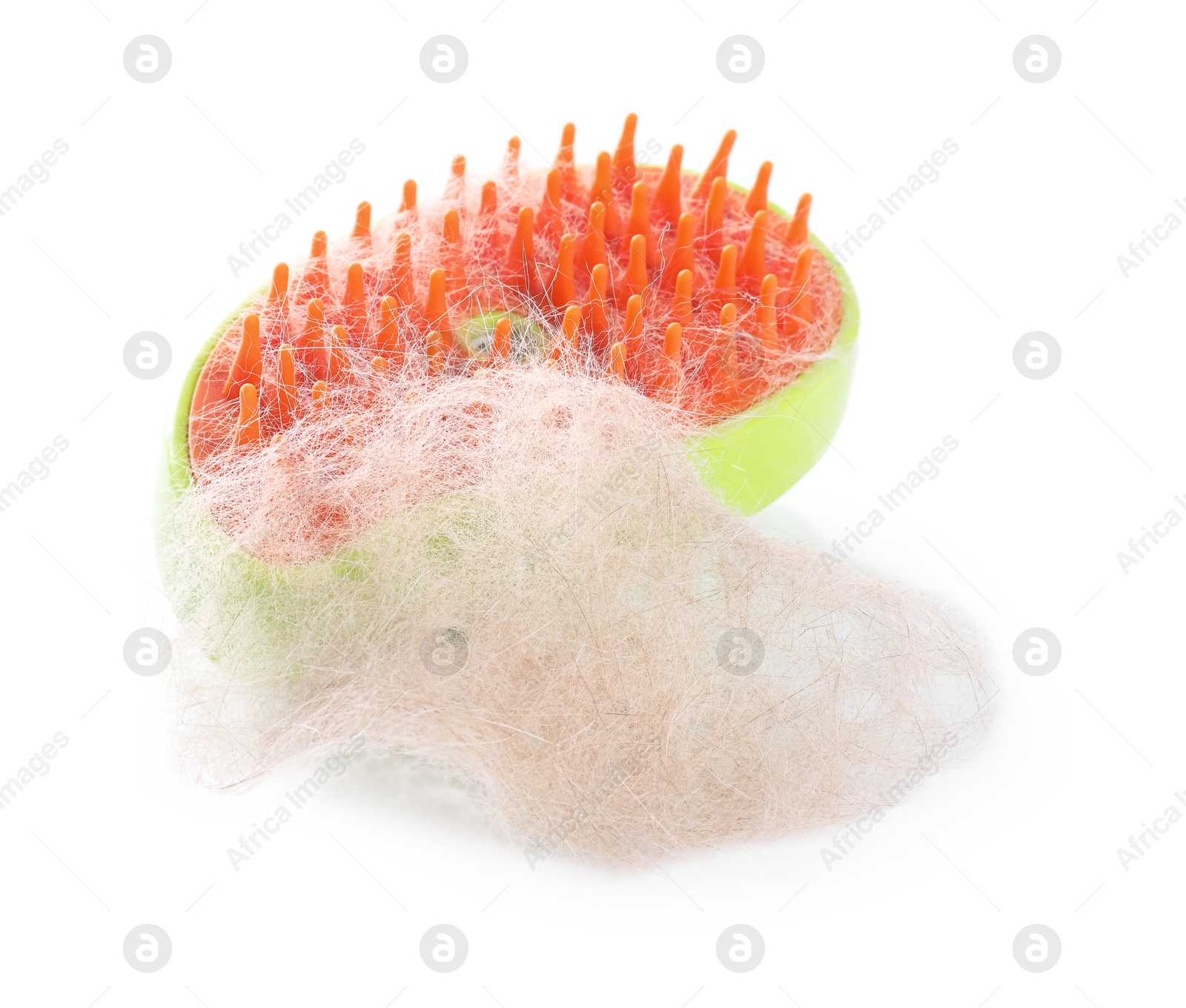 Photo of Grooming brush and pile of pet's hair isolated on white