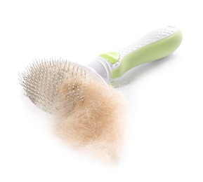 Photo of Grooming brush and pile of pet's hair isolated on white