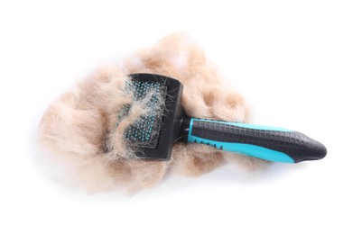 Photo of Grooming brush and pile of pet's hair isolated on white, above view