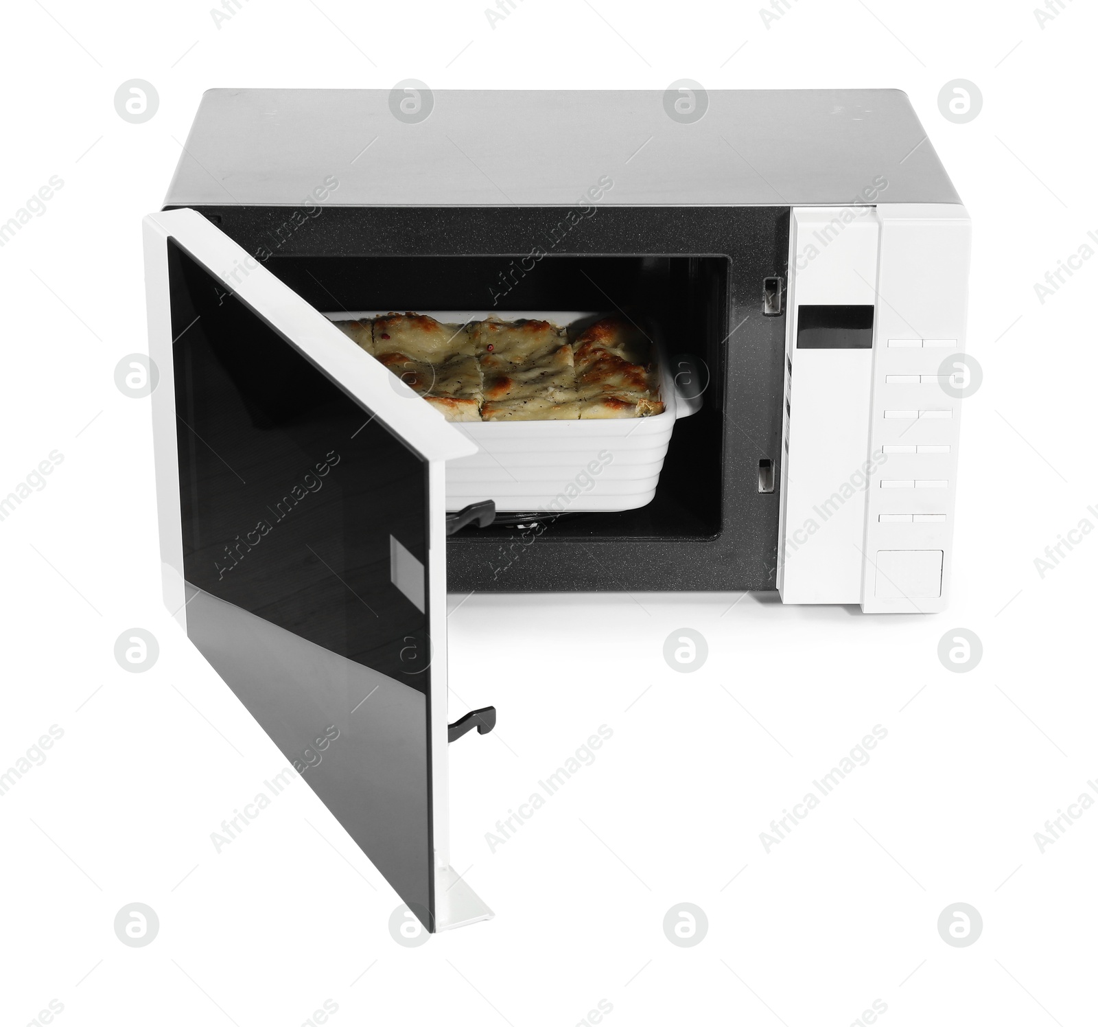 Photo of Open microwave oven with tasty lasagna isolated on white