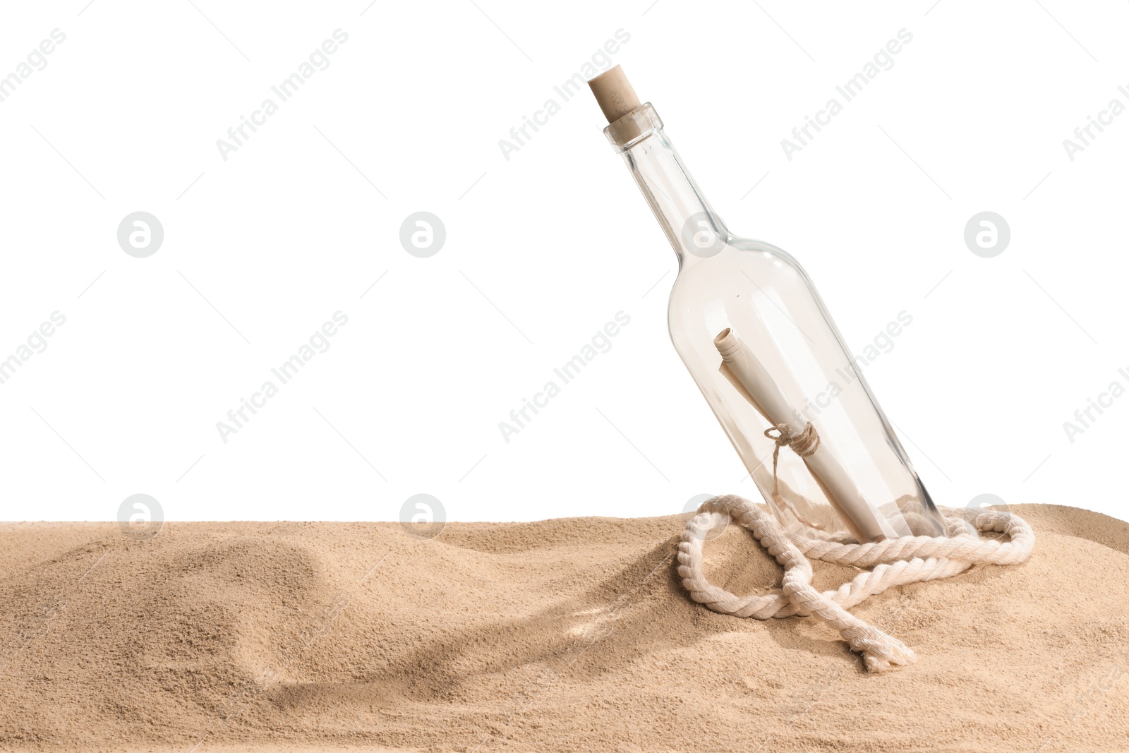 Photo of Rolled letter in corked glass bottle and rope on sand against white background