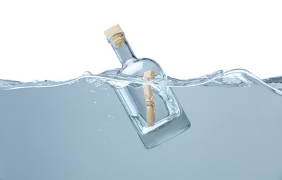 Photo of Corked glass bottle with rolled letter in water on white background