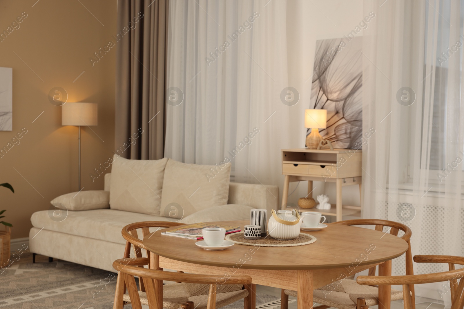 Photo of Beautiful furniture and decor in cozy living room. Interior design