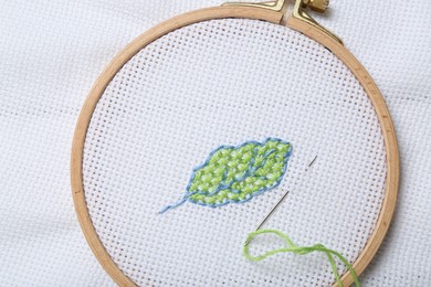 Photo of Canvas with embroidery in hoop, top view