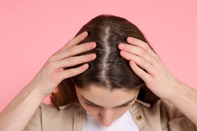 Photo of Girl with hair loss problem on pink background