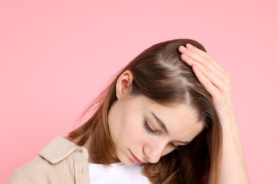 Photo of Girl with hair loss problem on pink background