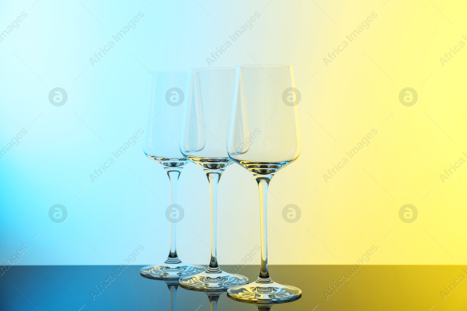 Photo of Empty glasses on table, color tone effect