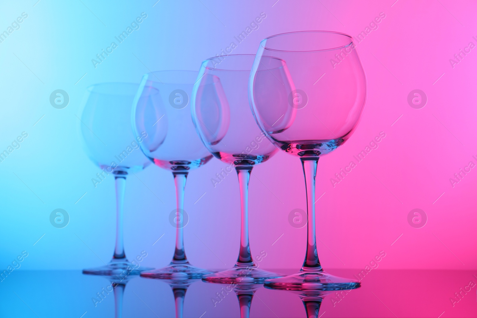 Photo of Empty glasses on table, color tone effect