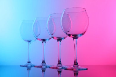 Photo of Empty glasses on table, color tone effect