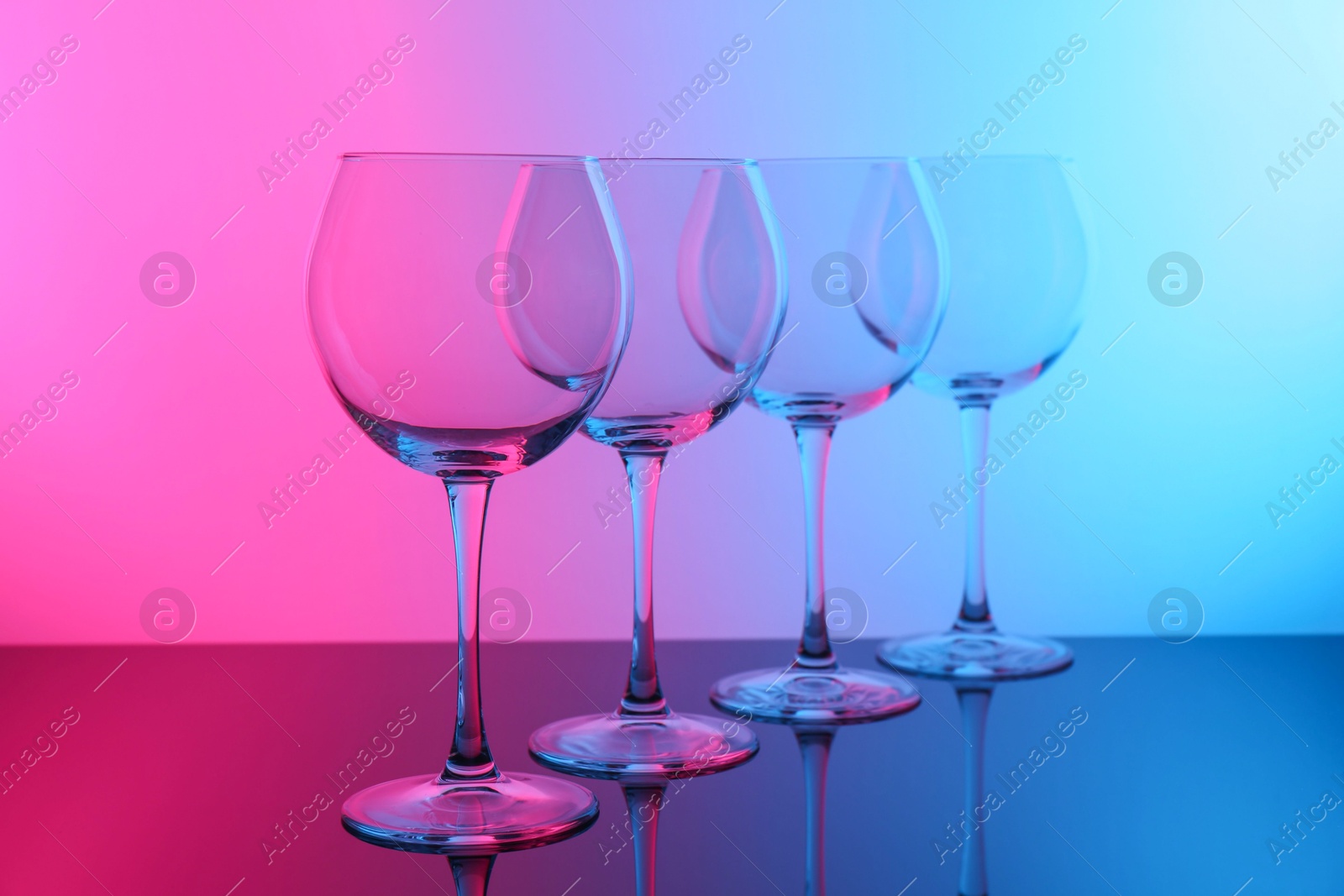 Photo of Empty glasses on table, color tone effect