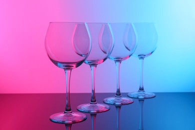 Photo of Empty glasses on table, color tone effect