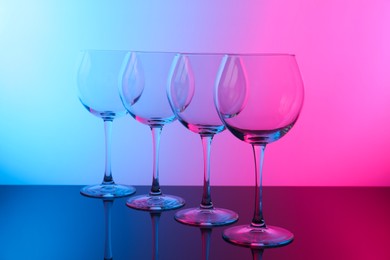 Photo of Empty glasses on table, color tone effect