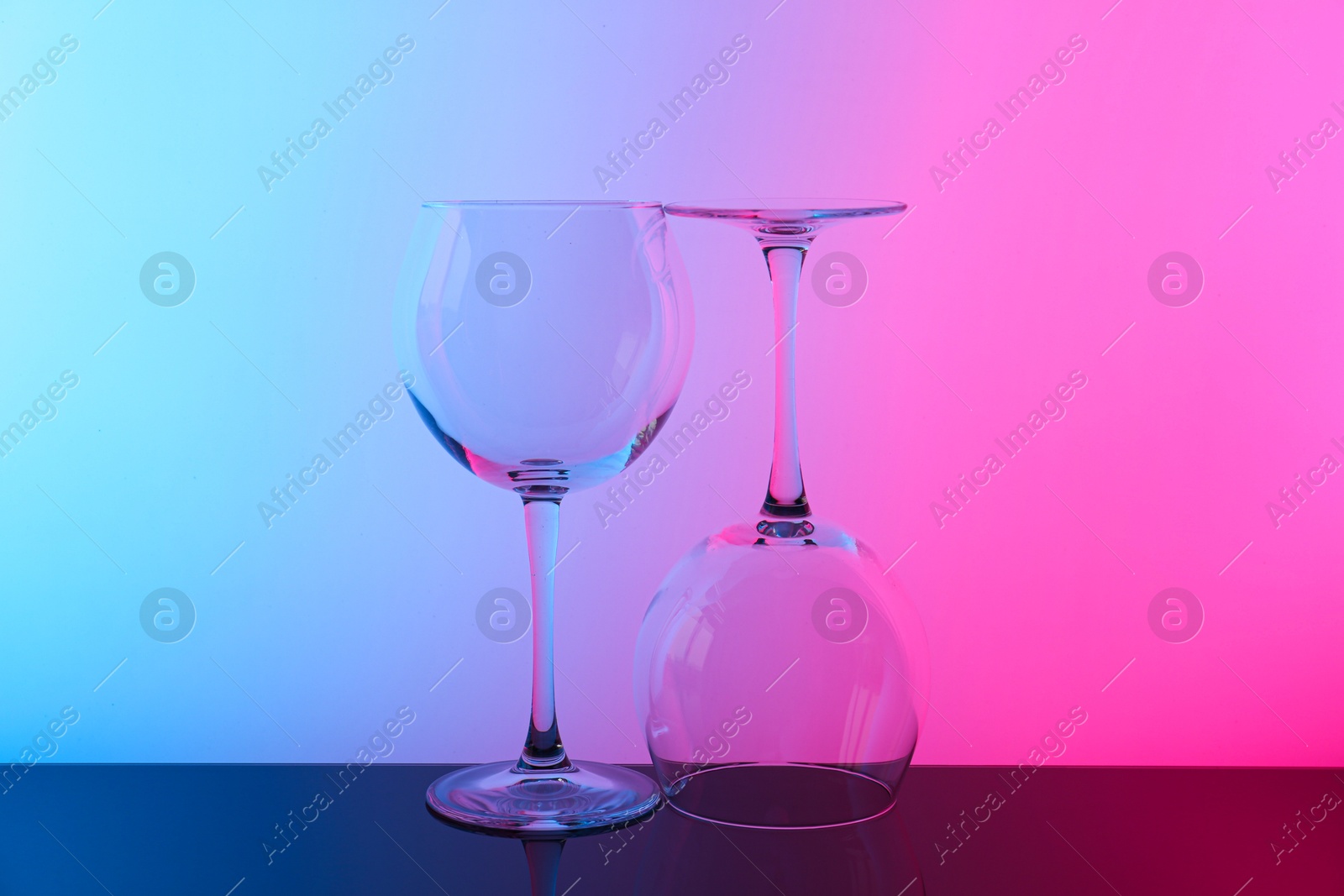 Photo of Empty glasses on table, color tone effect