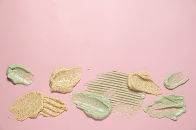 Photo of Samples of different body scrubs on pink background, top view. Space for text