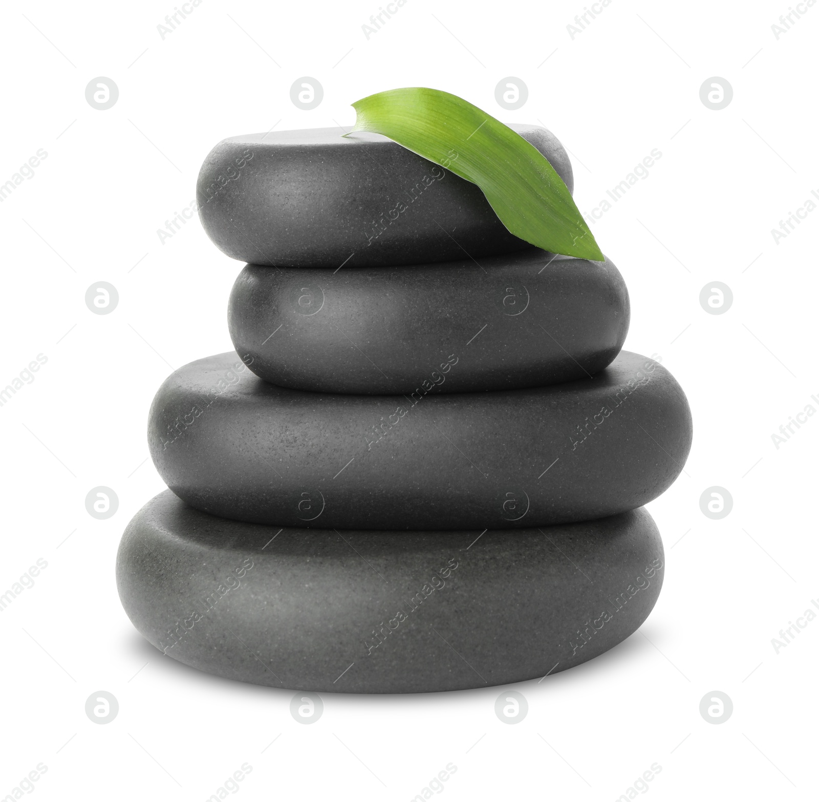 Photo of Spa stones with leaf isolated on white